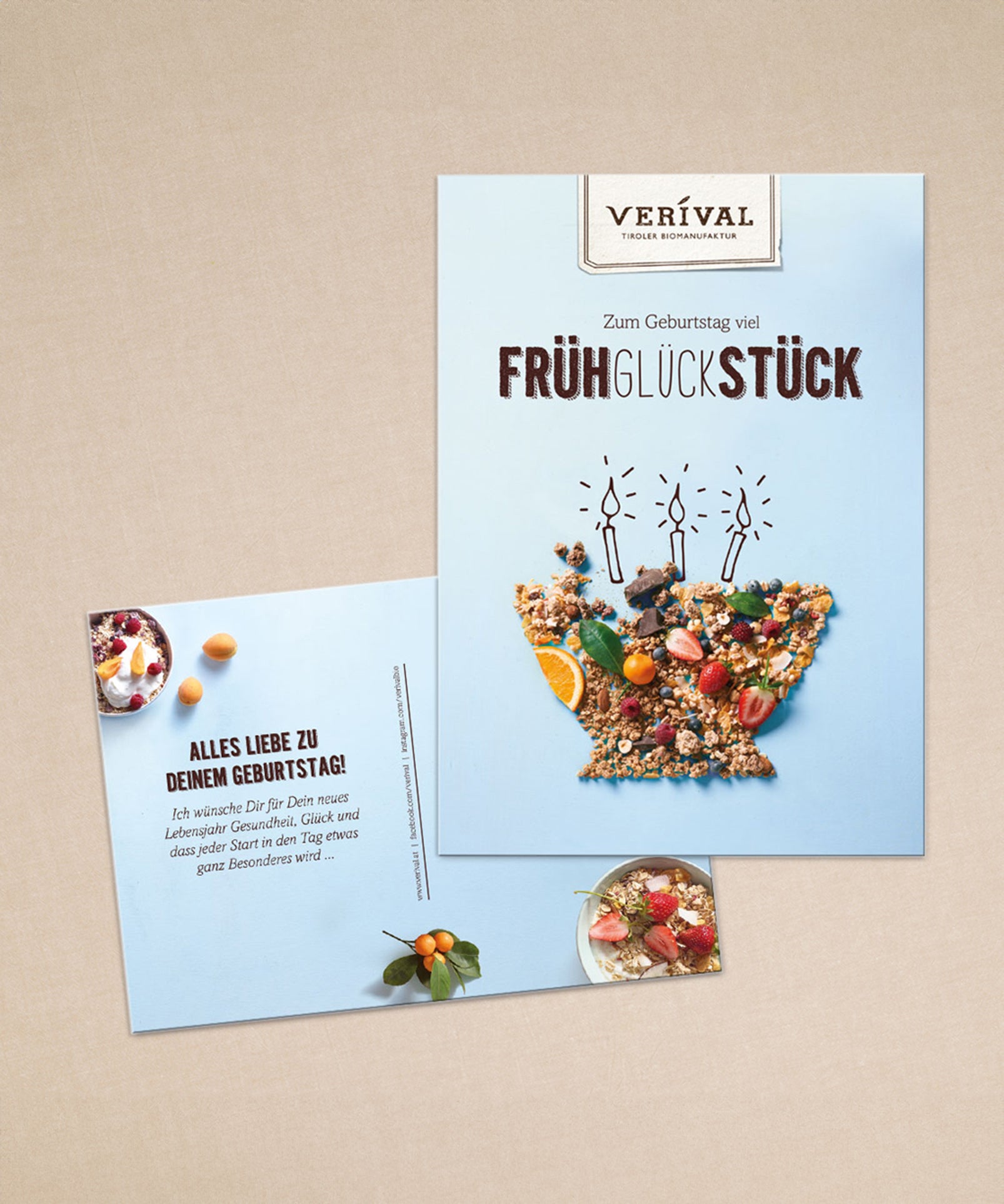 Zwei personalisierte Geburtstagskarten der Verival Bio GmbH zum Thema Frühstück: Eine mit Müslischale und  der Aufschrift „Frühglückstück“, die andere eine charmante Postkarte mit Geburtstagswünschen auf Deutsch.